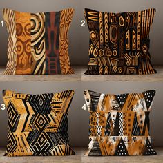 four pillows with different designs on them, one is orange and the other is black