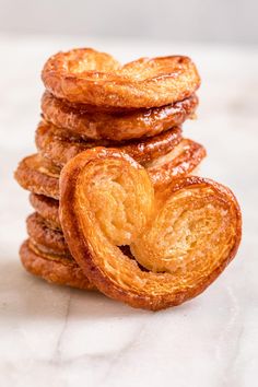 a stack of doughnuts sitting on top of a white counter