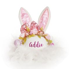 Shop our Personalised Pink Bow Easter Hat - a beautiful and unique hat that will have your little one feeling like the star of the show. The Personalised Pink Bow Easter Hat uses a white felt hat as the base and features white and pink sequin ears, a pink sequin bow, and gorgeous metallic gold with soft pink florals. Also available in a matching Personalised Pink Bow Easter Headband (sold separately) - ideal for a sibling or best friend. The hat is lovingly created, personalised by hand and made Whimsical White Mini Hat For Gifts, White Novelty Party Hat, Whimsical White Mini Hat As Gift, Novelty White Mini Hat With Curved Brim, White Novelty Mini Hat With Curved Brim, Playful White Party Hat, Whimsical White Hat For Birthday, Whimsical White Hat For Parties, Cute White Adjustable Costume Hats