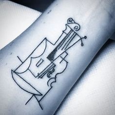 a black and white photo of a tattoo on someone's arm with an arrow