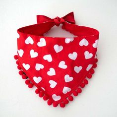 a red bandana with white hearts on it