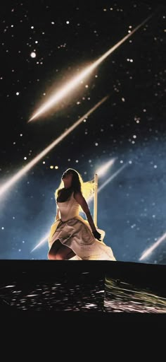 a woman in white dress sitting on top of a boat under a star filled sky