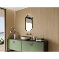 a bathroom with a sink, mirror and large sliding glass door leading to the outside