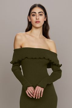 This dress is fall-ready. Crafted from viscose yarn, this design offers a luxe, body-hugging feel with an elasticated neckline, ensuring it stays perfectly in place all night. Delicate lettuce edges and slits on both sides add movement and a touch of playful elegance. DETAILS off shoulder neck, bodycon silhouette, midi length, long sleeve COMPOSITION 72% recycled viscose, 28% recycled polyester, high stretch, not lined, imported dry clean only SUSTAINABILITY REF: 58112476 Jumpsuit Wedding Guest, Wedding Jumpsuit, Knit Midi, Knit Midi Dress, Matching Dresses, Shoulder Sweater, Black Tie, Lettuce, Midi Length