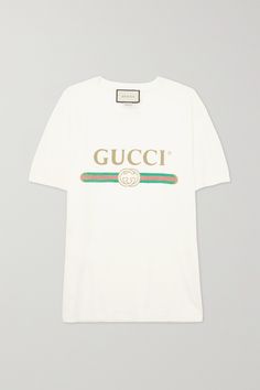 Gucci's T-shirt has been spotted on everyone from Margot Robbie to Olivia Culpo. Cut from lightweight cotton-jersey, this oversized version is detailed with faded gold lettering, the label's signature web motif and a playful floral appliqué at the back. It's distressed around the neckline for a vintage feel. Emme Parsons, Agolde Shorts, Gucci Shirt, Gucci T Shirt, Laura Lombardi, Gucci Outfits, Olivia Culpo, Gold Lettering, Print Coat