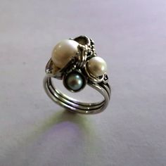 From Porans collection---> Fresh Water Pearls Ring,Unique Elegant,Romantic Ring, Perfect Christmas Gift Sterling silver ring with 3 pearls(1x3mm, 1x4mm, 1x6mm) Dimensions: Front Width(max):18 mm Back width(min): 4 mm Can be any size you want. Come in an exquisite jewelry box ready to be given away as a gift to your beloved ones or thyself. For Express shipping please purchase: https://www.etsy.com/il-en/listing/166710514/express-shipping? This will make a total fee of 30$ for postal costs and Elegant Stackable Sterling Silver Pearl Ring, Elegant Sterling Silver Stackable Pearl Ring, Elegant Handmade Pearl Promise Ring, Silver Akoya Pearl Ring With Pearl Drop, Silver Akoya Pearl Drop Ring, Silver Pearl Open Ring, Elegant White Handmade Stackable Rings, Elegant Stackable Rings With Pearl Drop For Gift, Elegant Pearl Drop Stackable Rings For Gift