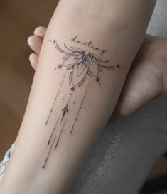 a woman's arm with a tattoo on it that reads, believe and arrows