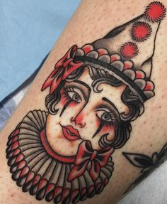 a woman's face with a hat on her head is shown in this tattoo design