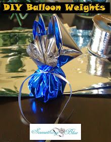 an origami ballon weight on a table with blue ribbon around it and the words diy balloon weights