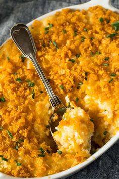 a casserole dish filled with mashed potatoes and garnished with parsley