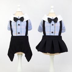 two mannequins dressed in black and blue clothing with bows on their heads