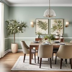 an elegant dining room with green walls and wood flooring is featured in this image