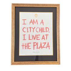 i am a city child, i live at the plaza framed art print in black and red