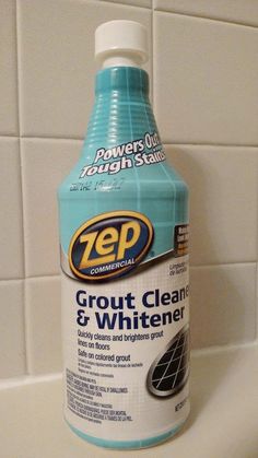 a bottle of zep grout cleaner sitting on top of a sink