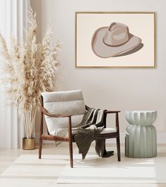 a living room with a chair, vases and a hat hanging on the wall