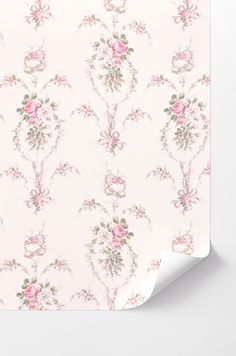 a pink floral wallpaper with roses and leaves on the side, next to a white background