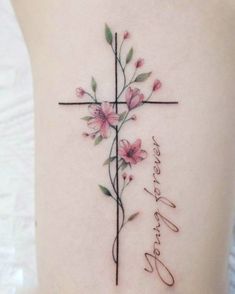 a cross with pink flowers on it and the words, i love you forever written in cursive writing