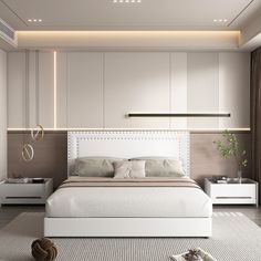 a white bed sitting in a bedroom next to a wall mounted shelf with lights on it