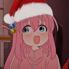 a girl with pink hair wearing a santa hat