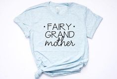 a t - shirt with the words fairy grand mother printed on it, sitting against a white background