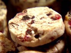 closeup of cookies with cranberry toppings stacked on top of each other