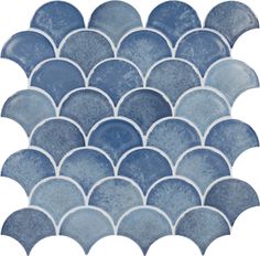 a blue and white mosaic tile pattern with wavy waves on it's sides, as well as an oval design in the center