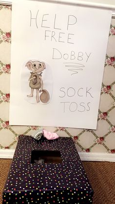 there is a sign that says help free dobby sock tosses on the floor