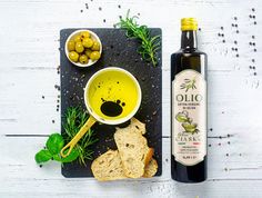 olive oil and bread on a cutting board