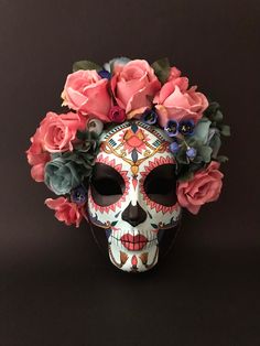 a skull mask with flowers on it