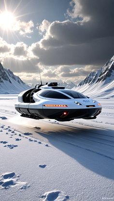 a futuristic car driving on snow covered ground with mountains in the background and sun shining through clouds