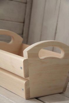 a wooden toy car sitting on top of a table