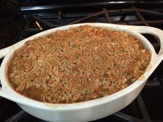 a casserole dish is sitting on top of the stove, ready to be eaten