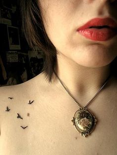 a woman's chest with birds on it and the words tiny tattoos