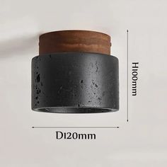 an image of a black and brown light fixture with measurements for the size, width, and height