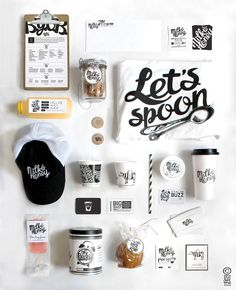 the contents of a coffee shop laid out on a white surface with black and white lettering