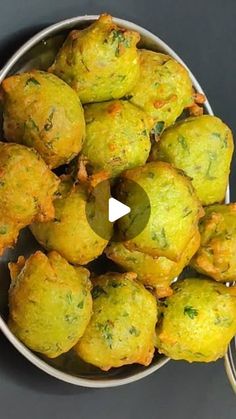 a bowl filled with fried food on top of a table