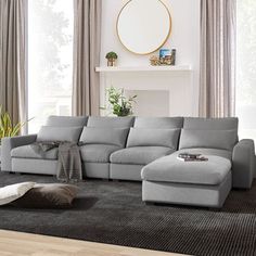 a living room with a large gray sectional couch