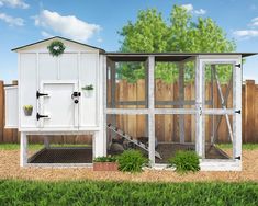 a white chicken coop sitting on top of a lush green field