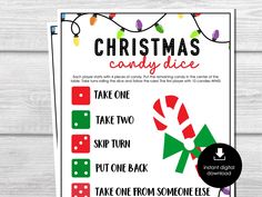 the christmas candy dice game is shown on a white wooden background with text that reads, take