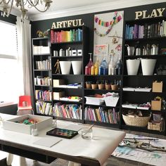 an artful playroom with bookshelves and craft supplies