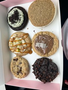 a box filled with different types of cookies