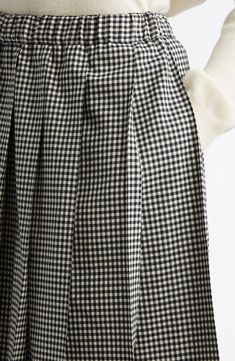 A crisp gingham check and clean pleats bring charming precision to a modest midi skirt fashioned in Japan from pure wool. 30" length (size Medium) Elastic waist Unlined 100% wool Dry clean Made in Japan Designer Clothing Asian & Pacific Islander Owned/Founded Pacific Islander, Wool Skirt, Gingham Check, Wool Skirts, Comme Des Garcons, Skirt Fashion, Gingham, Designer Clothing, Midi Skirt