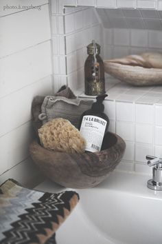 a bathroom sink with soap and other items on it