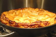 an apple pie sitting on top of a stove