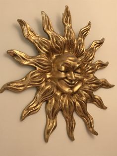 Big sun. Dimension: Height:87cm Width:87cm The Sun is a symbol of Venice. This Mask is made in paper mache,decorated with five layer of gold leaf. We use a special varnish for to protect the gold leaf,and a special technique for create an age effect. All our masks are handmade papier-machè masks made in Venice. Our decorators use techniques typical of the Venetian tradition such as stucco, acrylics, gold and silver-leaf, macramè, passementerie, pearls and crequelè to give you a wide range of mas Gold Masks For Theater And Festivals, Gold Venetian Party Mask, Masquerade Mask Sun, Traditional Gold Mask, Gold Fantasy Theater Mask, Medieval Symbols, Sun Mask, Greek Theatre, Costume Masks