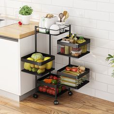 three tiered food storage rack with fruits and vegetables on wheels in the corner of a kitchen