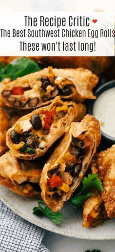 some food is sitting on a plate with ranch dressing in the background and text that reads, the recipe critic the best southwest chicken egg rolls these won't last long