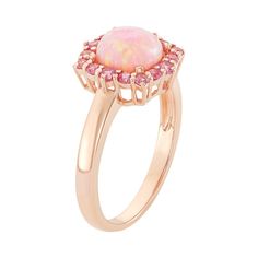 Grace yourself with the feminine beauty of this 18k rose gold-over-silver ring. A lab-created opal stone framed by lab-created pink sapphire stones creates a lovely square halo design.RING DETAILS Width: 12 mm Metal: 18k rose gold over sterling silver STONE DETAILS Stone type: lab-created pink opal, lab-created pink sapphire Shape: cushion, round Setting: prong Gender: female. Age Group: adult. Square Halo Ring, Sapphire Stones, Halo Design, Right Hand Rings, Feminine Beauty, Opal Stone, Womens Fashion For Work, Sapphire Stone, Pink Opal