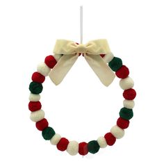 a red, white and green christmas wreath ornament with a bow on top