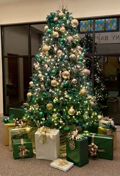 a christmas tree with presents under it